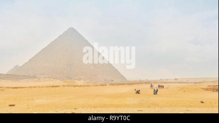 GIZA, EGYPT - DECEMBER 20, 2017: The large archaeological complex of Giza during winter dusty mist, on December 20 in Giza Stock Photo