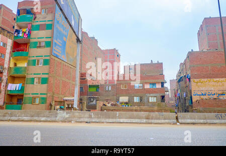 CAIRO, EGYPT - DECEMBER 20, 2017: The poor neighborhood with shabby buildings in the suburb of Cairo, on December 20 in Cairo. Stock Photo