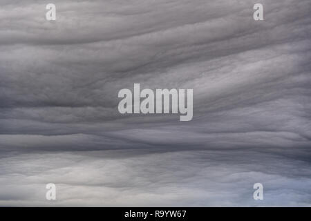 Brooding Grey storm clouds forming on an evening. In upland area UK. Stock Photo