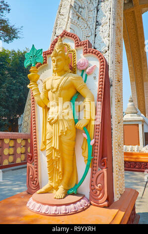 The statue of Nat (Spirit deity) in front of the entrance gate to the temple of Sitagu International Buddhist Academy, Sagaing, Myanmar. Stock Photo