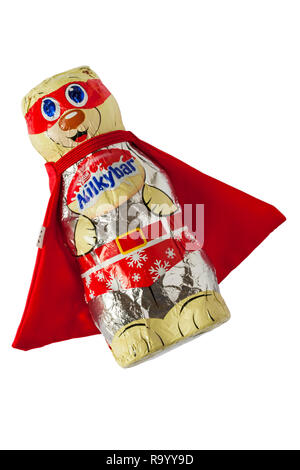 Nestle Milkybar hollow white chocolate Polar Bear figure dressed in wearing red cape isolated on white background Stock Photo