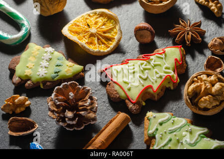 variety of christmas food products ginger cake nuts cinnamon stick lollipop Stock Photo