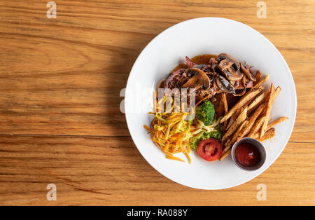 Gourmet Meatloaf with Wine Gravy, Vegetables and Hand Cut Fried Potatos Stock Photo