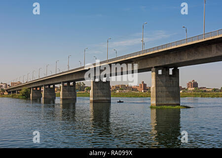 Panoramic view of large concrete road bridge spanning large wide nile river in Egypt at Kom Ombo Stock Photo