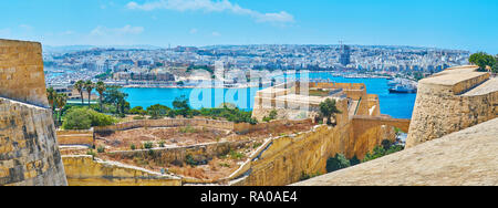 Watch preserved medieval fortifications of Valletta from the top of St Michael's Bastion, located on the West side of City Gate and facing Ta'Xbiex an