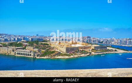 The view on the medieval star fort on Manoel Island and the modern coast of Gzira and Sliema resorts behind it from the top of St Michael's Bastion of