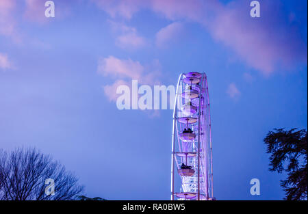The big ferris wheel on background of sunny blue sky Stock Photo