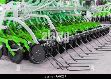 Corn harvester head with several silver blades. Agricultural machinery for soil cultivation Stock Photo