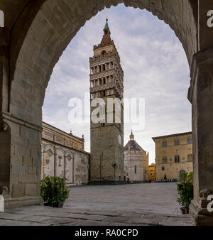 Almost deserted Piazza del Duomo framed by an arch of the Palazzo del Comune, Pistoia, Tuscany, Italy Stock Photo