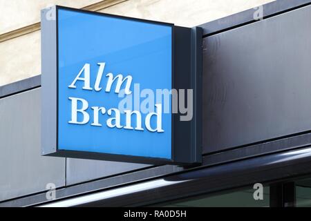 Copenhagen, Denmark - August 28, 2018: Alm Brand logo on a wall. Alm Brand a Danish financial services group Stock Photo