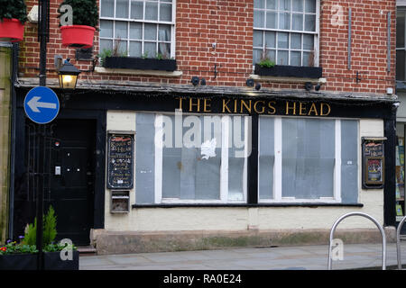 December 2018 - The empty and deserted Kings Head pub public house on the high street in Wells, Somerset