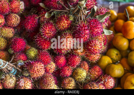 Large number of Rambutan at the market in Siem Reap, Cambodia. Stock Photo