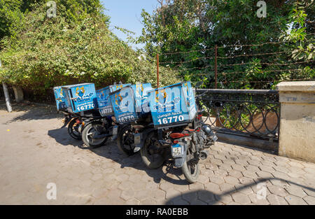 Fish Market restaurant food delivery motorbikes parked by the roadside on a sunny day in Giza, Cairo, Egypt Stock Photo