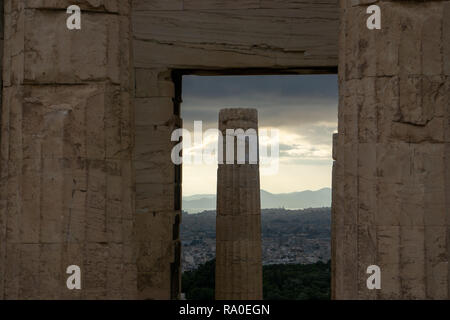 Even though the column appears as solitary, it is a part of the Temple of Athena Nike. The sun-illuminated architecture is the epiphany of elegance. Stock Photo