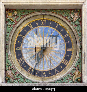 Ancient clock on an exterior wall of the Lutheran Church of Holy Spirit in Tallinn, Estonia Stock Photo