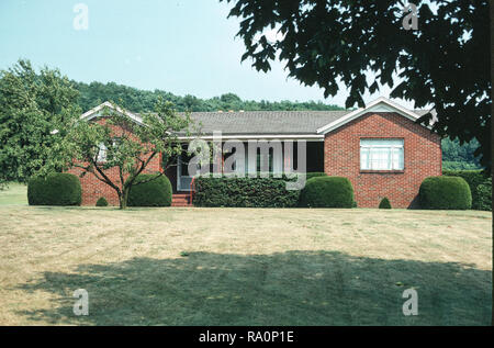 Modest ranch style brick house in the northeast in summer, Pennsylvania, USA Stock Photo