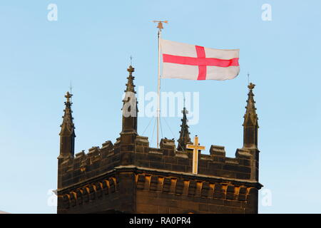St George's Flag flying high and proud above Swillington on St Mary's Church Tower. Stock Photo