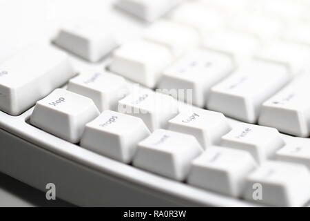 Modern computer keyboard. some part of white computer keyboard, Focus on special key "Stop". Stock Photo