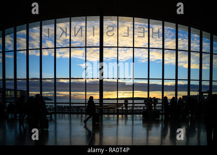 View to Baltic sea from big glass wall of port of Helsinki. Winter, sunset Stock Photo