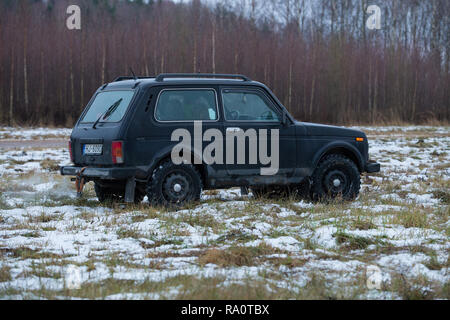 City Cesis, Latvia. Black car Niva in winter. Made in USSR, 4 x4 jeep. Travel urban photo 2018. 29. december. Stock Photo