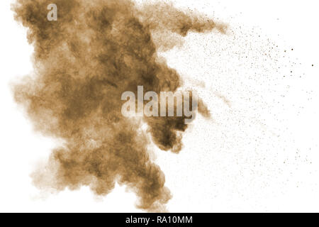 Abstract deep brown dust explosion on white background. Stock Photo