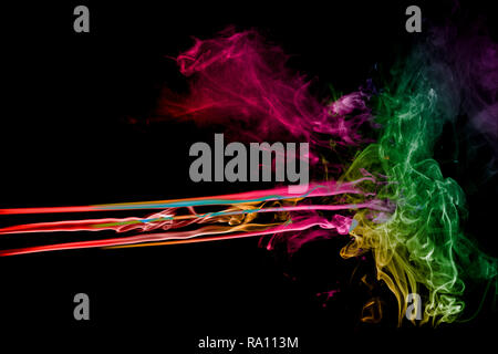 Abstract multi colored smoke flowed on black background. Stock Photo