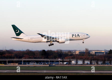 Boeing 777-240, Pakistan International Airlines. PIA. Landing at Heathrow airport terminal 5, London. UK. Stock Photo