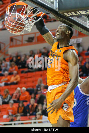 Stillwater, OK, USA. 29th Dec, 2018. Oklahoma State Forward Cameron McGriff (12) dunks the ball during a basketball game between the Texas A&M University-Corpus Christi Islanders and Oklahoma State Cowboys at Gallagher-Iba Arena in Stillwater, OK. Gray Siegel/CSM/Alamy Live News