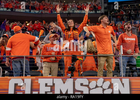 Arlington, Texas, USA. 29th Dec, 2018. December 29, 2018 - Arlington, Texas, U.S. - Clemson Tigers fans celebrate after a touchdown in the College Football Playoff Semifinal at the Goodyear Cotton Bowl Classic between the Notre Dame Fighting Irish and the Clemson Tigers at AT&T Stadium, Arlington, Texas. Credit: Adam Lacy/ZUMA Wire/Alamy Live News Stock Photo