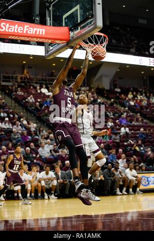 Texas, USA. December 29, 2018. 29th Dec, 2018. College Station, TX, U.S -TSU TRAYVON REED (5) slam dunks in the first half at Reed Arena. Credit: Jerome Hicks/ZUMA Wire/Alamy Live News