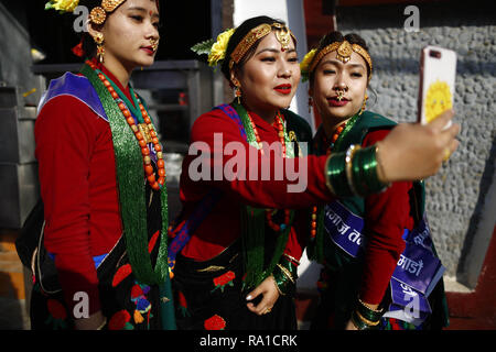 Kathmandu, Nepal. 30th Dec, 2018. Women from the Gurung community take a selfie during a rally to celebrate Tamu Lhosar festival as their new year in Kathmandu, Nepal on Sunday, December 30, 2018. This year is the year of deer. (Credit Image: © Skanda Gautam/ZUMA Wire) Credit: ZUMA Press, Inc./Alamy Live News Stock Photo