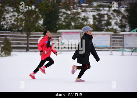 Qiandongnan, China's Guizhou Province. 30th Dec, 2018. Children run in snow in Danzhai County of Qiandongnan Miao and Dong Autonomous Prefecture, southwest China's Guizhou Province, Dec. 30, 2018. Credit: Yang Wukui/Xinhua/Alamy Live News Stock Photo