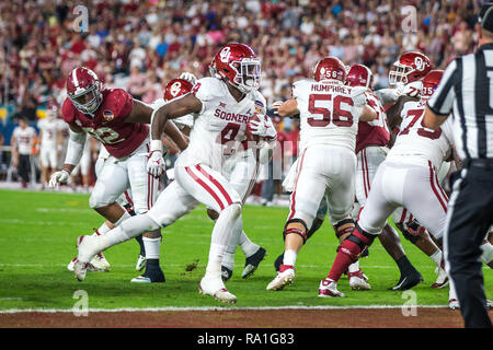 Florida, USA. 29th Dec, 2018. Oklahoma Sooners running back Trey Sermon (4) carries the ball into the end zone for a for a 2 yard touchdown during the second quarter against the Alabama Crimson Tide in the 2018 Capital One Orange Bowl at Hard Rock Stadium on December 29, 2018 in Florida. Credit: Travis Pendergrass/ZUMA Wire/Alamy Live News Stock Photo