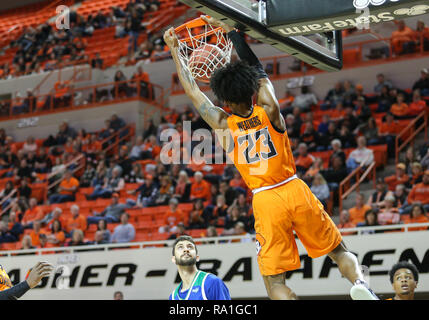 Stillwater, USA. 29th Dec, 2018. Oklahoma State Guard Michael Weathers (23) dunks the ball during a basketball game between the Texas A&M University-Corpus Christi Islanders and Oklahoma State Cowboys at Gallagher-Iba Arena in Stillwater, OK. Gray Siegel/CSM/Alamy Live News