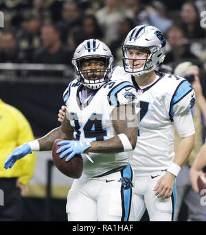 Carolina Panthers running back Cameron Artis-Payne (34) crosses the goal  line against New Orleans Saints cornerback Marshon Lattimore (23) on a  tcoudhown carry in the first half of an NFL football game