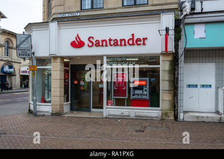 Entrance to Santander bank in Trowbridge Wiltshire UK with the street name sign above, and the cashpoint in the window Stock Photo