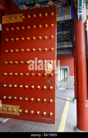 A red and gold studded  door dating from The Ming Dynasty at the Summer Palace Beijing China Stock Photo