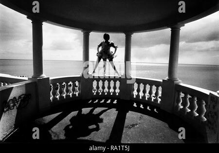 Actress and Dancer Jane Bassett in her famous role as Dame Anna Peglova the three legged ballerina. She is posing on the Colonnade in Bexhill, Sussex, England, opposite the De La Warr Pavillion. Stock Photo