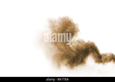 abstract brown dust explosion on  white background ,abstract brown powder splattered on white background , Freeze motion of brown powder exploding. Stock Photo