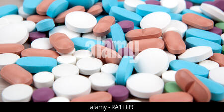 background of many multi-colored medical pills close up Stock Photo