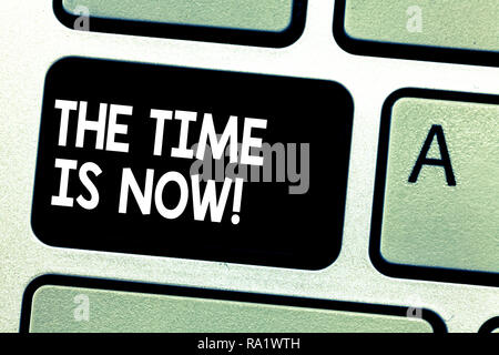 Text sign showing The Time Is Now. Conceptual photo Encouraging someone to start doing today not tomorrow Keyboard key Intention to create computer me Stock Photo