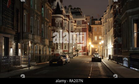 St. James Hotel and Club facade. Picture taken in London, Park Place at night. Few expensive cars park at this street.  Mayfair London Stock Photo