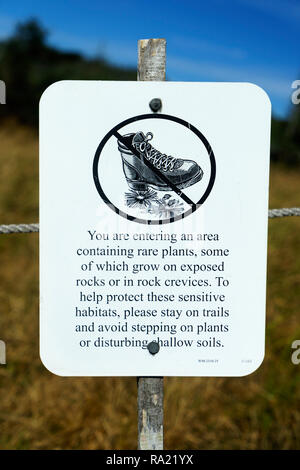 Sign warning hikers to stay on the trails to prevent damage to fragile plants on Franconia Ridge, New Hampshire, USA. Stock Photo