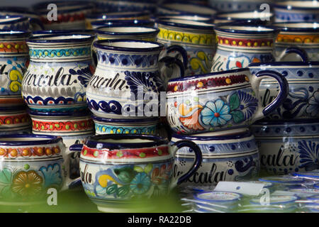 colorful Talavera mugs with Tlaxcala name engraved on them is a very popular souvenir in the state of Tlaxcala Stock Photo