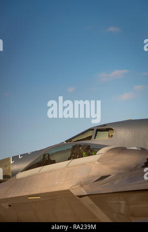 Two modern military jet fighter aircraft, grey against a blue sky Stock Photo