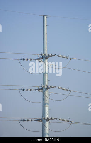 Some birds sitting on high voltage lines Stock Photo