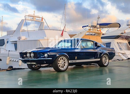 Palma de Mallorca, Spain - October 24, 2013: Classic rare American muscle car, vintage blue Ford  Mustang Shelby Cobra GT-500 Fastback on a pier in Ma Stock Photo
