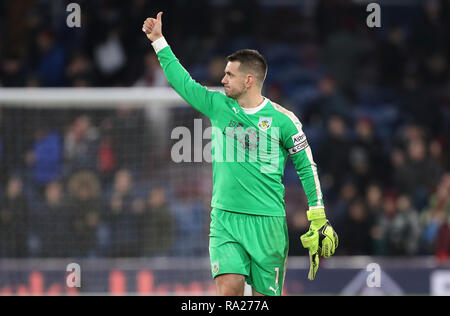 Burnley goalkeeper Thomas Heaton celebrates after the final whistle during the Premier League match at Turf Moor, Burnley. Stock Photo