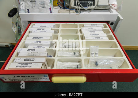 Drawer in a hospital crash trolley for emergency resuscitation containing drugs. Stock Photo