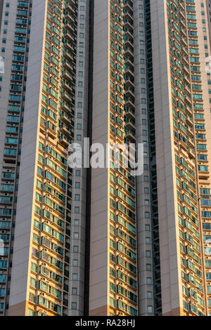 The seemingly endless wall of humanity that form the Victoria Towers high rise residential development on Canton Road in Tsim Sha Tsui, Hong Kong Stock Photo